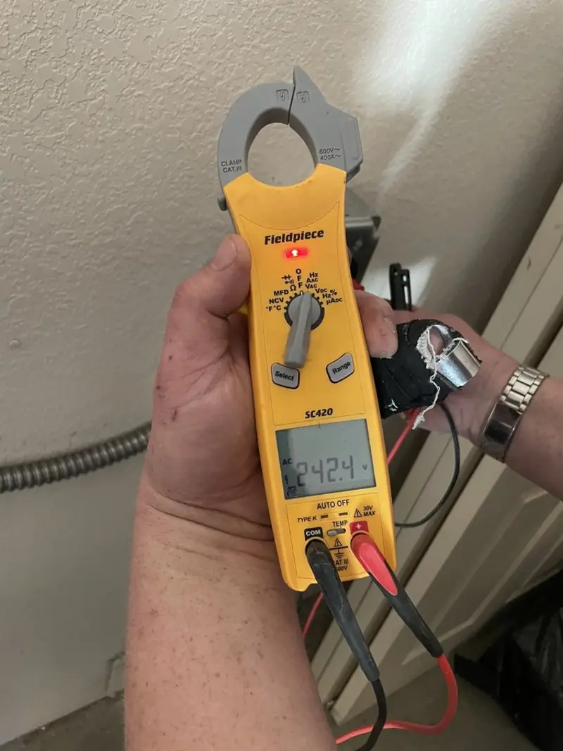 Voltage testing with clamp meter during Aluminum Wiring Replacement in Leroy